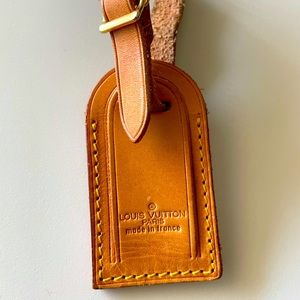 Authentic Louis Vuitton suit case tag